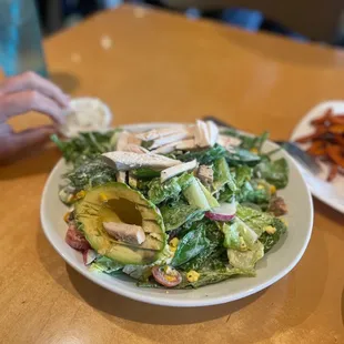 a plate of salad and fries