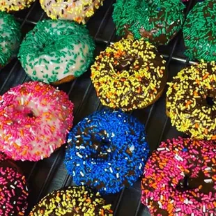 a variety of sprinkled donuts