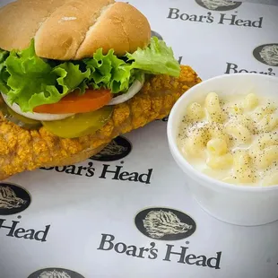 a chicken sandwich and macaroni salad