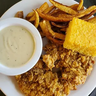 Chicken Fried Steak with creamy homemade gravy Homestyle Fries and sweet corn bread.
