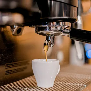 coffee being poured into a cup