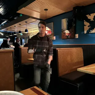 a man walking through the restaurant