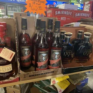 a shelf of liquor bottles