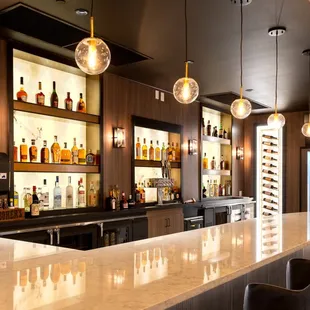 a bar with chairs