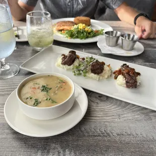a plate of food and a bowl of soup