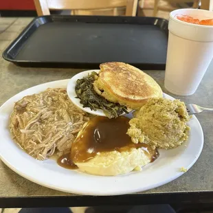 Turkey and gravy, mustard greens, mashed taters and gravy, dressing and bread.
