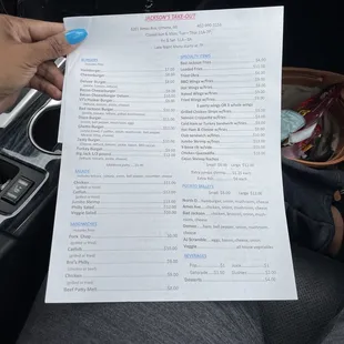 a hand holding a piece of paper