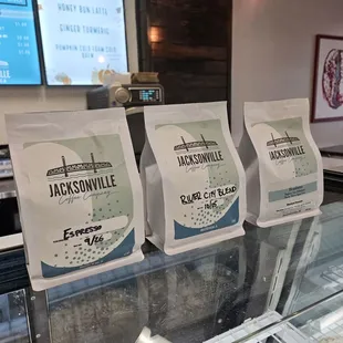 three bags of coffee on display