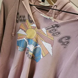 a t - shirt with a sun design on it