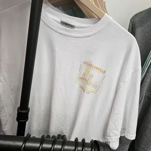 a t - shirt hanging on a rack