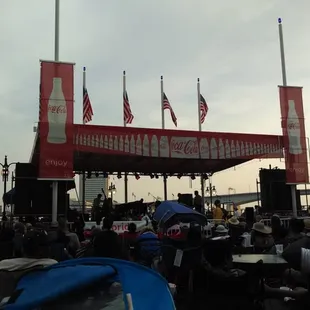 a large crowd of people sitting at tables