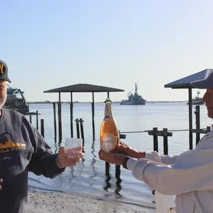 Morning toast of her arrival! My father-in-law is on the left. Retired Navy Captain, John O'Neil Jr