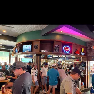 a crowd of people at the bar