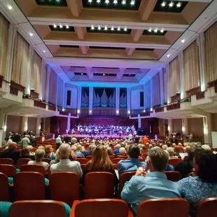 a large auditorium full of people