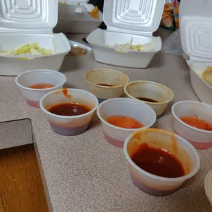 These are BRAND NEW SAUCES that came with our 6 person order. They are 1/4 full and definitely not enough to coat the sweet and sour chicken