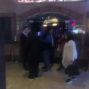 Shaking hands when audience walks out. Very kind but your show still sucked.