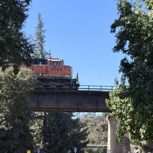 Train on the train tracks overpass in the park - you will see one if you're at the park