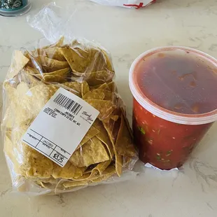 a bag of chips and a drink