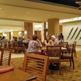 dining area with people sitting at tables