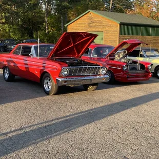 classic cars parked in a parking lot