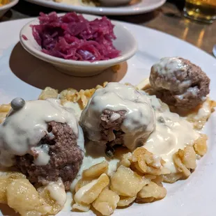 German meatballs with lemon caper sauce and sauerkraut