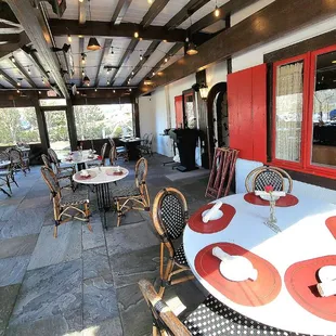 The covered front porch. The doorway to the interior is on the right. This is located at the back of L'auberge Chez François.