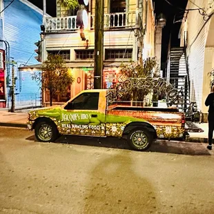 a pick up truck parked on the side of the road