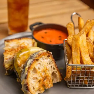 a grilled cheese sandwich and french fries