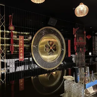 a bar with a large clock on the wall