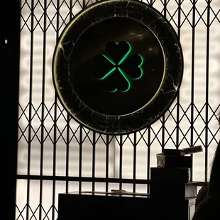 a woman sitting in front of a clock