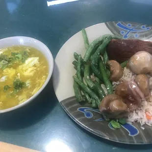 a plate of food and a bowl of soup