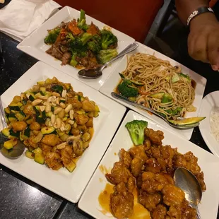 four plates of food on a table