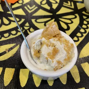 a bowl of ice cream with a spoon in it