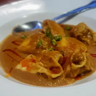 Szechuan wonton appetizer with spicy peanut satay, $7.95