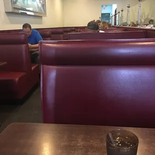 a man sitting at a table in a restaurant