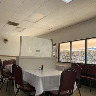 a table and chairs with a white tablecloth