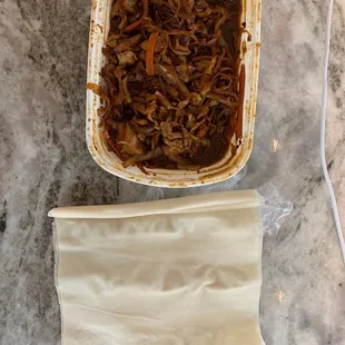 a casserole dish and a bag of noodles