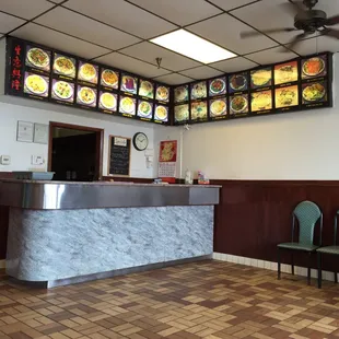 a restaurant counter and seating area