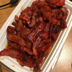 a tray of cooked bacon on a table