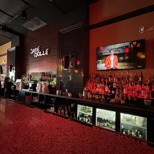 a bar with a large screen tv