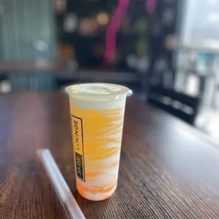 a drink in a plastic cup with a straw