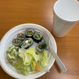 Sushi, coleslaw, salad