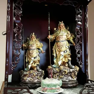two statues of a man and a woman