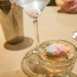 a martini glass with a dessert in it