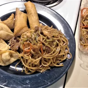 a plate of noodles and dumplings