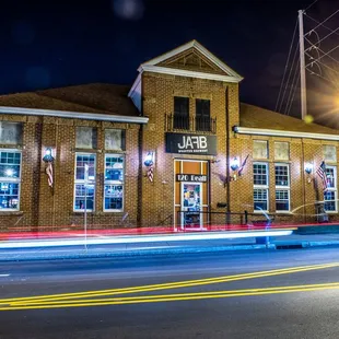 a blurry image of a street at night