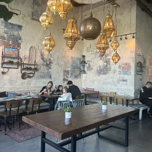 people sitting at tables in a restaurant