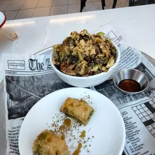 a plate of food and a bowl of salad