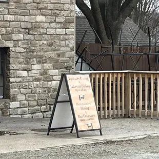 a sign on the sidewalk