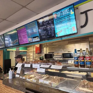 a woman ordering food at the counter